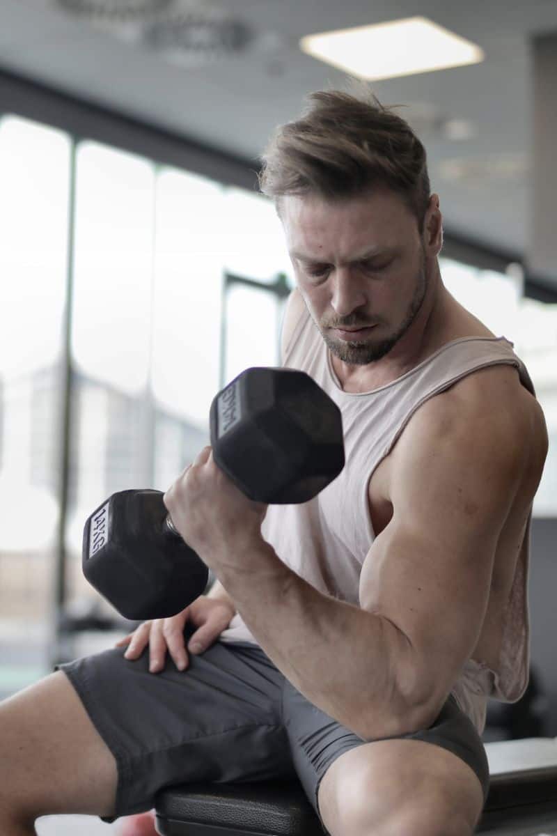 man lifting weights